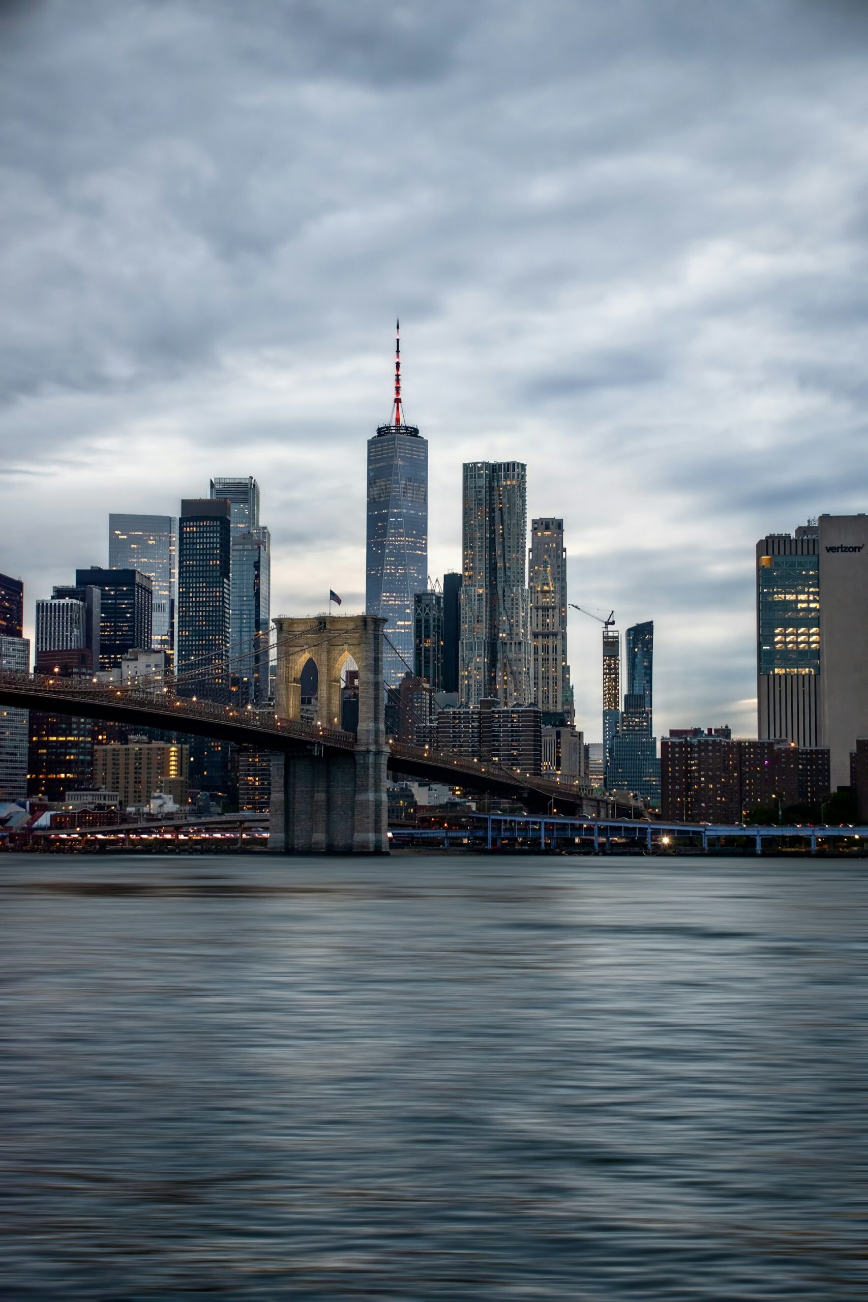 New York City skyline with Brooklyn Bridge at dusk